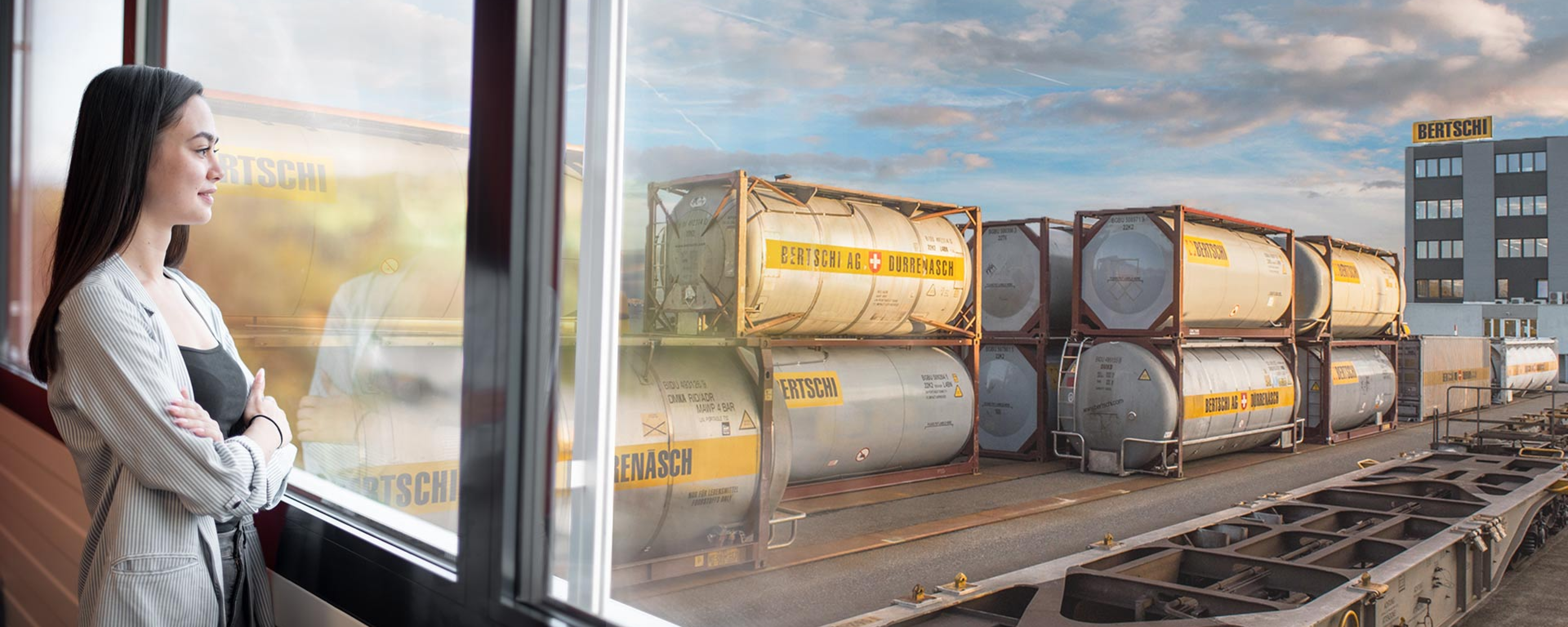 A woman overlooks a BERTSCHI container terminal.